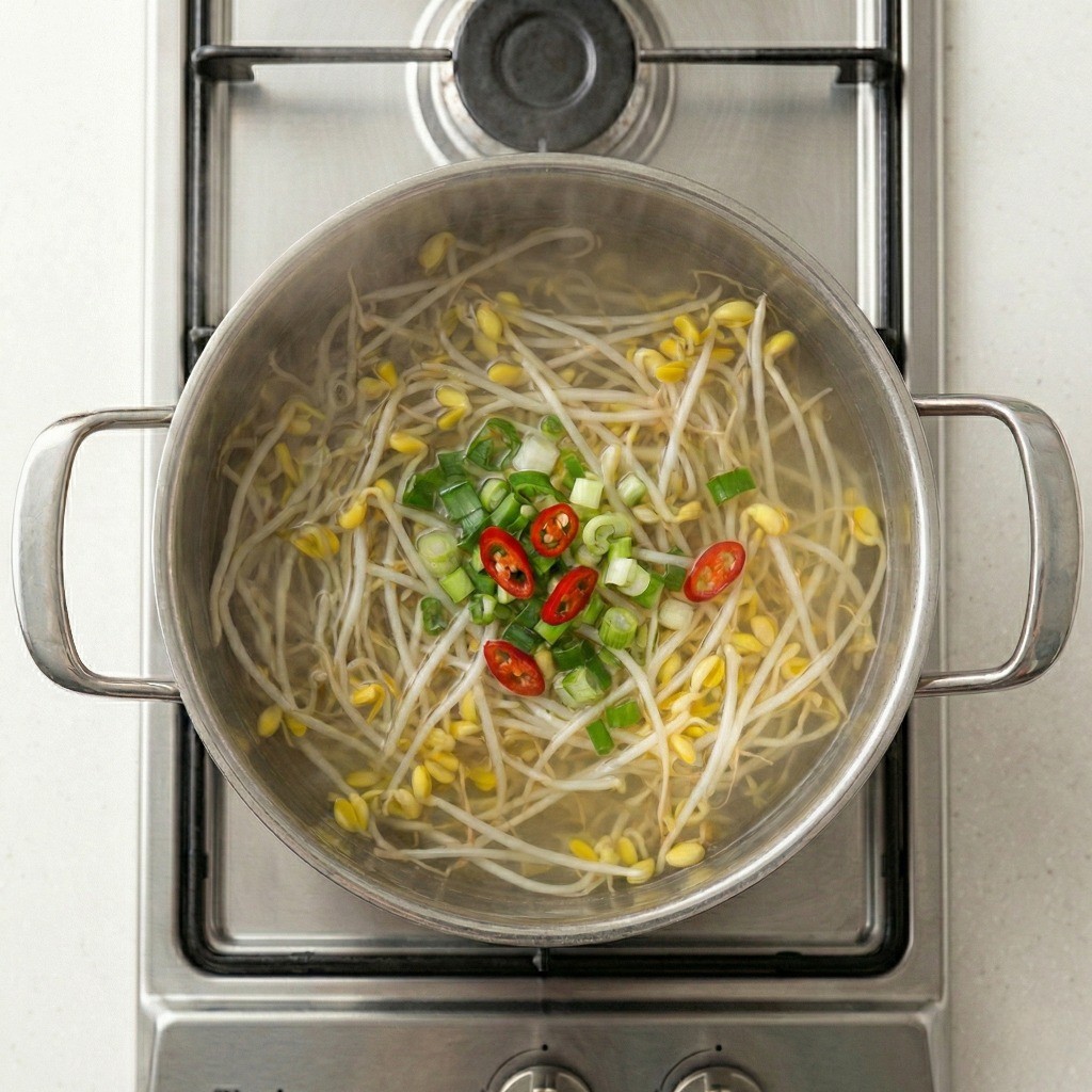 백종원 콩나물국 레시피 4단계 - 송송 썬 대파와 청양고추를 넣어 시원한 해장국 완성하기